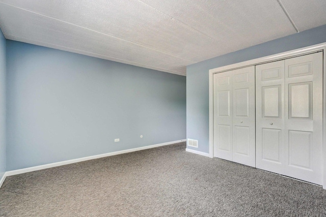 512 Redondo Dr Unit 112, Downers Grove, IL 60516 - unfurnished bedroom with carpet, a closet, and a textured ceiling