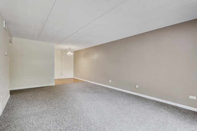 512 Redondo Dr Unit 112, Downers Grove, IL 60516 - spare room featuring carpet flooring and a chandelier