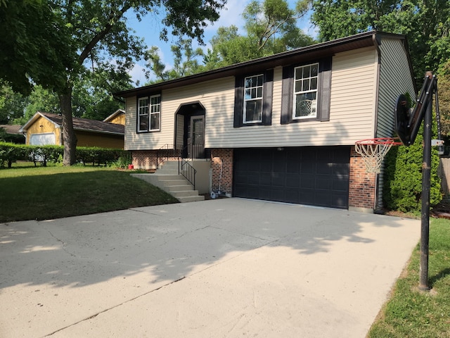 814 S 11th Ave, Saint Charles, IL 60174 - raised ranch featuring brick siding, a garage, driveway, and a front lawn