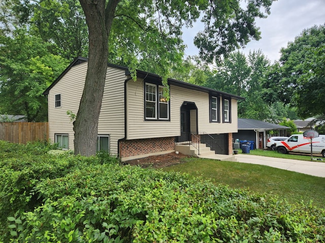 814 S 11th Ave, Saint Charles, IL 60174 - bi-level home featuring driveway and brick siding