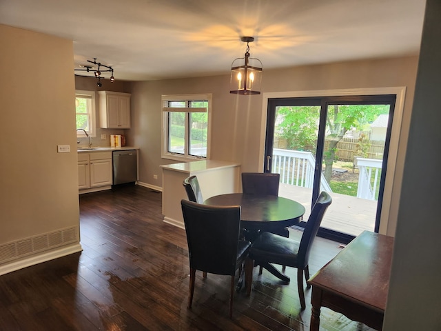 814 S 11th Ave, Saint Charles, IL 60174 - dining space with dark wood finished floors, rail lighting, and a chandelier