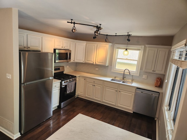 814 S 11th Ave, Saint Charles, IL 60174 - kitchen featuring stainless steel appliances, light countertops, dark wood-type flooring, backsplash, and white cabinetry