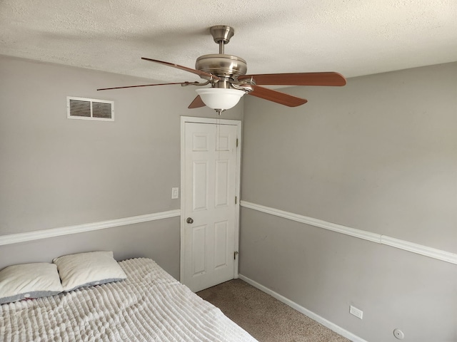 814 S 11th Ave, Saint Charles, IL 60174 - carpeted bedroom featuring a textured ceiling and ceiling fan