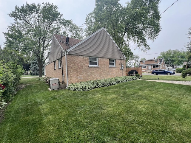 201 S Roy Ave, Northlake, IL 60164 - view of home's exterior with brick siding and a yard