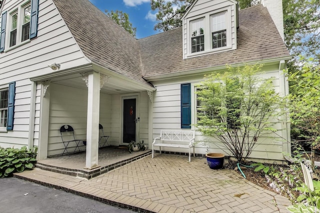 1667 Sunnyside Ave, Highland Park, IL 60035 - entrance to property featuring roof with shingles and a chimney