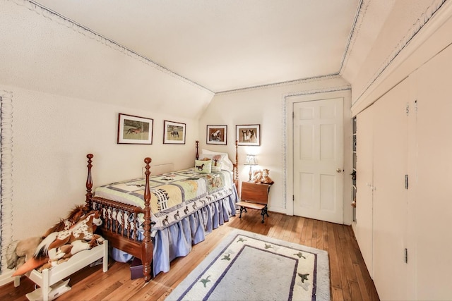 1667 Sunnyside Ave, Highland Park, IL 60035 - bedroom with vaulted ceiling and hardwood / wood-style floors