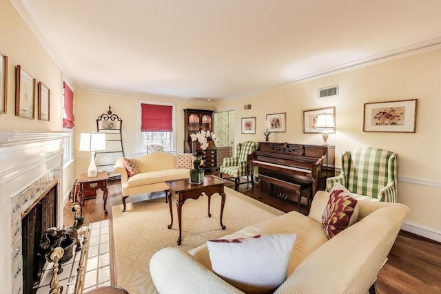 1667 Sunnyside Ave, Highland Park, IL 60035 - living area with a fireplace, wood finished floors, and ornamental molding