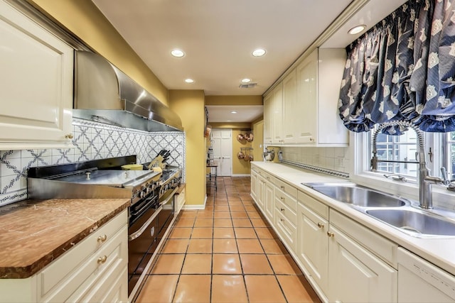 1667 Sunnyside Ave, Highland Park, IL 60035 - kitchen with double oven range, white dishwasher, wall chimney exhaust hood, light tile patterned floors, and backsplash