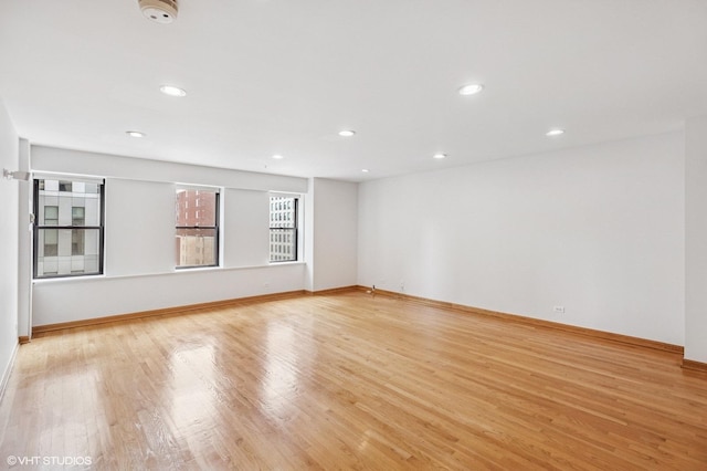 40 E 9th St Unit 903, Chicago, IL 60605 - unfurnished room with a smoke detector, light wood-style flooring, and recessed lighting