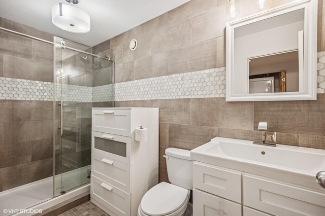40 E 9th St Unit 903, Chicago, IL 60605 - full bath with tile walls, a stall shower, and vanity