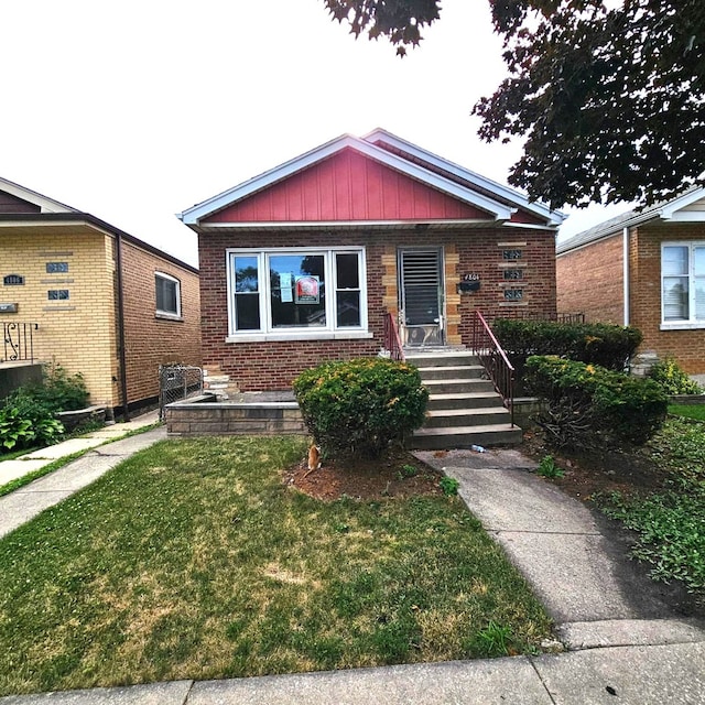 4804 S Lamon Ave, Chicago, IL 60638 - bungalow-style home with brick siding and a front lawn