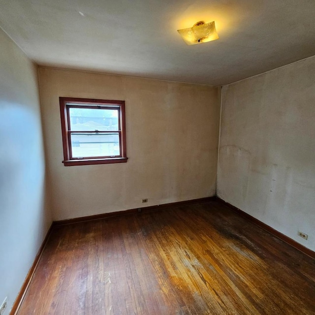 4804 S Lamon Ave, Chicago, IL 60638 - spare room featuring dark wood-type flooring and baseboards