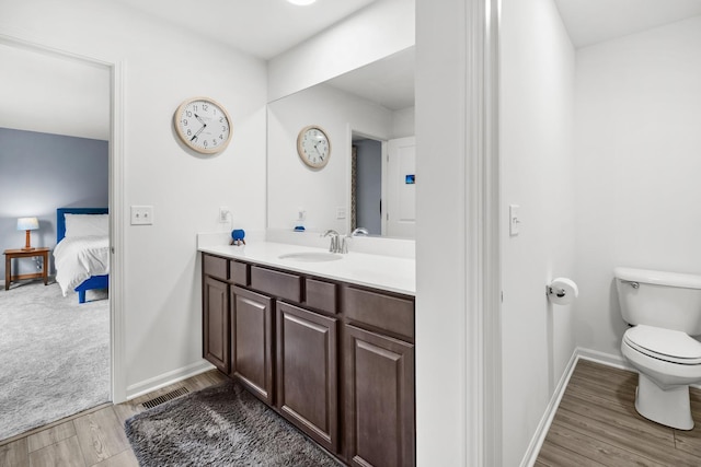 8520 White Oaks Ct, Wonder Lake, IL 60097 - ensuite bathroom featuring vanity and wood finished floors
