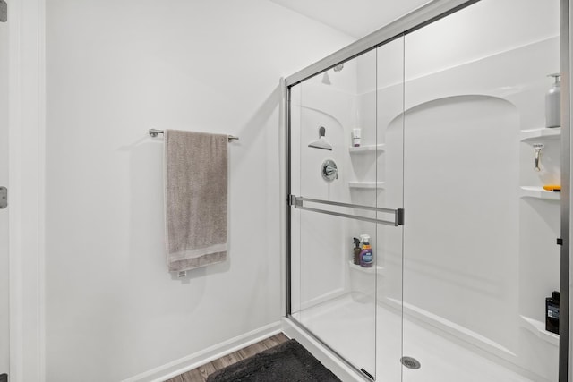 8520 White Oaks Ct, Wonder Lake, IL 60097 - bathroom with wood finished floors and a stall shower