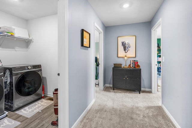 8520 White Oaks Ct, Wonder Lake, IL 60097 - laundry area with washing machine and clothes dryer and baseboards