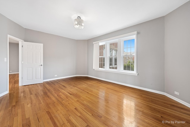 4321 N Drake Ave Unit 3W, Chicago, IL 60618 - empty room featuring baseboards and light wood-style flooring