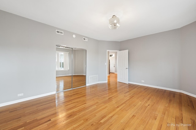 4321 N Drake Ave Unit 3W, Chicago, IL 60618 - unfurnished bedroom with a closet and light wood-type flooring