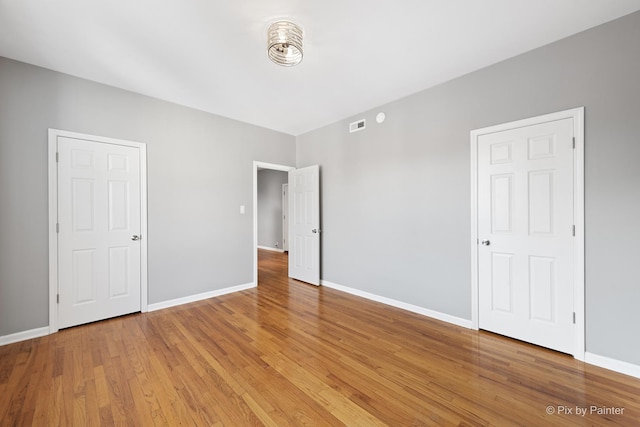 4321 N Drake Ave Unit 3W, Chicago, IL 60618 - unfurnished bedroom featuring light wood-style floors