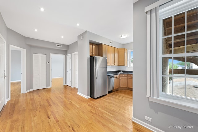 4321 N Drake Ave Unit 3W, Chicago, IL 60618 - kitchen with appliances with stainless steel finishes, light wood finished floors, dark countertops, and recessed lighting