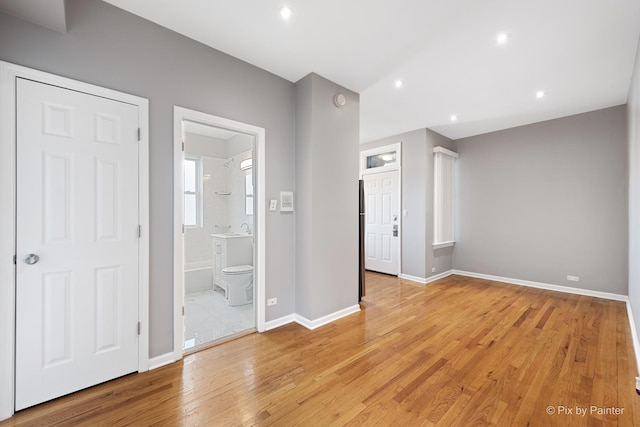 4321 N Drake Ave Unit 3W, Chicago, IL 60618 - unfurnished bedroom with light wood-style flooring, recessed lighting, and ensuite bath
