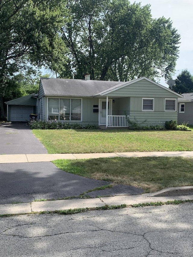 2605 Park St, Rolling Meadows, IL 60008 - ranch-style house with a front yard, asphalt driveway, and board and batten siding