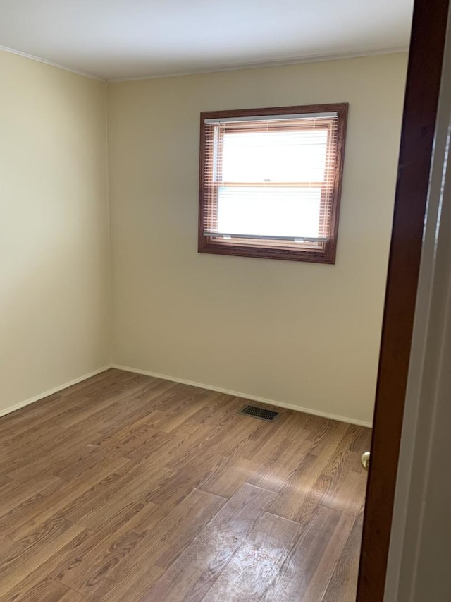 2605 Park St, Rolling Meadows, IL 60008 - empty room featuring wood finished floors and crown molding