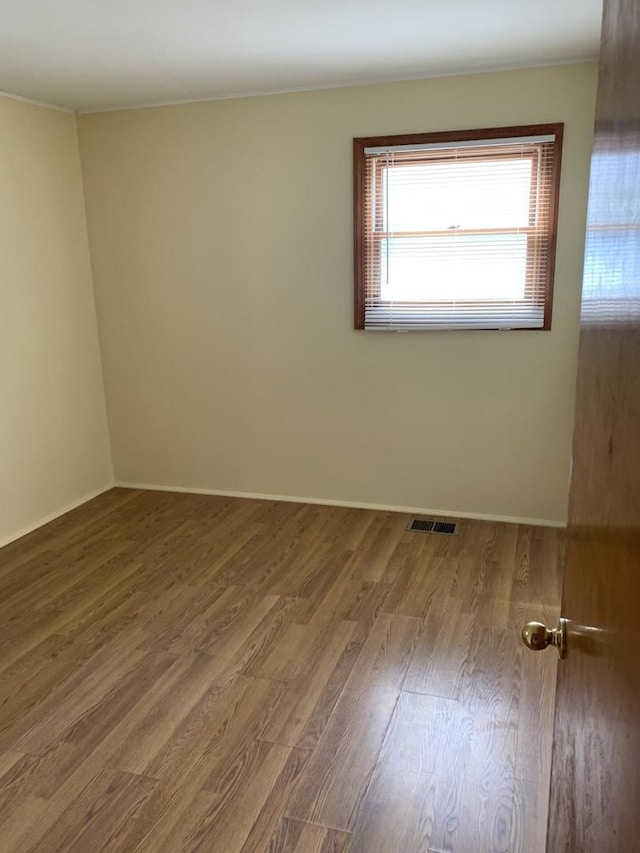 2605 Park St, Rolling Meadows, IL 60008 - spare room with wood finished floors and baseboards