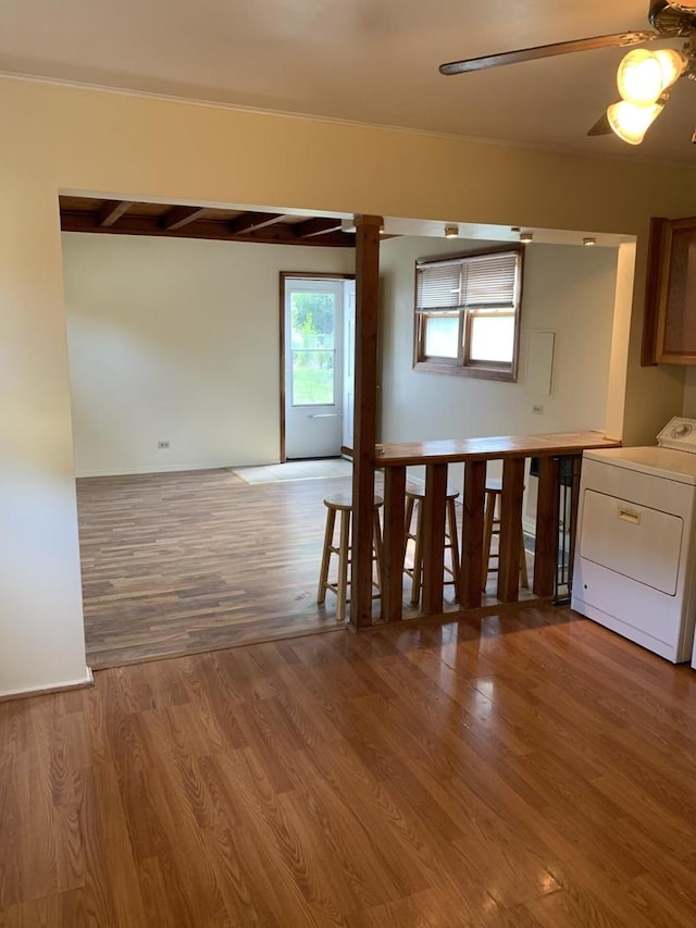 2605 Park St, Rolling Meadows, IL 60008 - unfurnished room with washer / dryer, wood finished floors, ceiling fan, and decorative columns