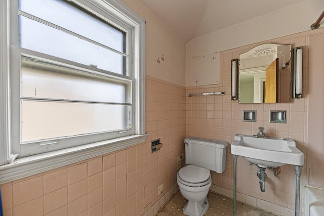 3713 S 57th Ct, Cicero, IL 60804 - half bath with tile walls, lofted ceiling, tile patterned flooring, and a wainscoted wall