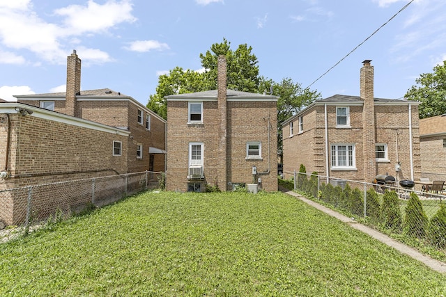3713 S 57th Ct, Cicero, IL 60804 - back of property featuring a fenced backyard, brick siding, and cooling unit