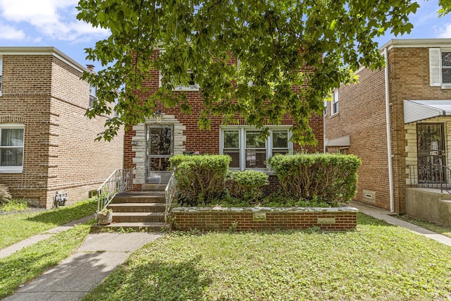 3713 S 57th Ct, Cicero, IL 60804 - view of front of house featuring a front lawn and brick siding