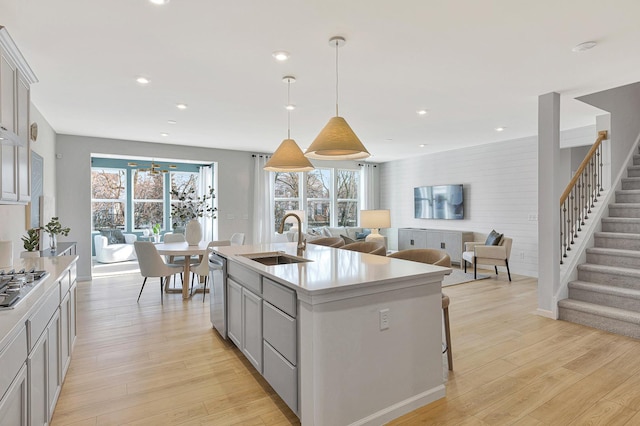 2611 Lawlor Ln, Naperville, IL 60564 - kitchen with light wood-style floors, light countertops, stainless steel appliances, open floor plan, and recessed lighting