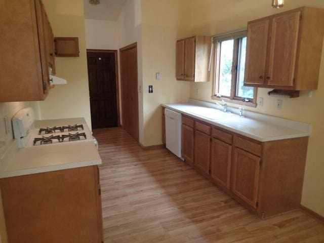 3430 Treadway Ct, Rockford, IL 61103 - kitchen with white appliances, light wood-style flooring, light countertops, brown cabinets, and extractor fan