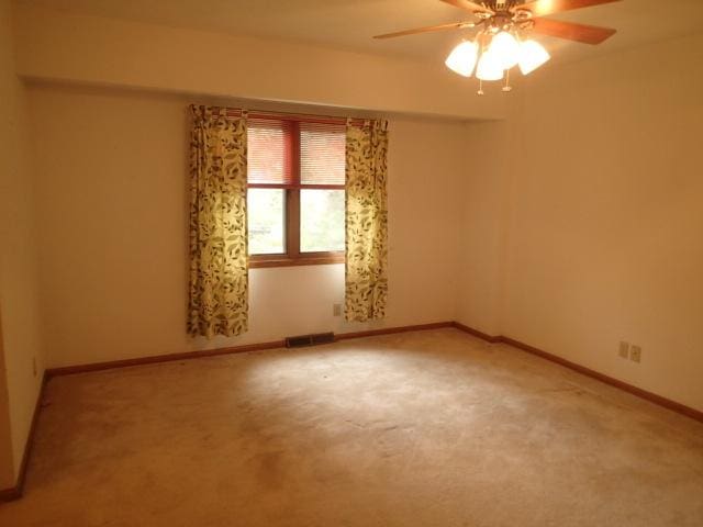 3430 Treadway Ct, Rockford, IL 61103 - spare room with a ceiling fan and light colored carpet