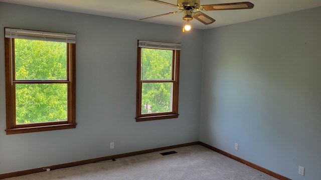 630 Maple Ct, Elburn, IL 60119 - spare room with plenty of natural light, carpet flooring, and a ceiling fan
