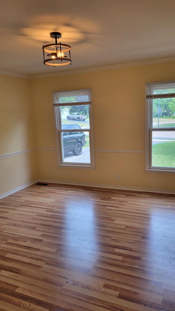 630 Maple Ct, Elburn, IL 60119 - unfurnished room featuring wood finished floors and ornamental molding