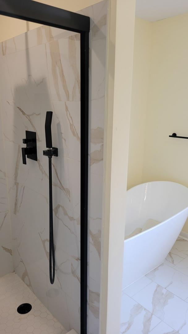 630 Maple Ct, Elburn, IL 60119 - full bathroom with a soaking tub, a marble finish shower, and marble finish flooring