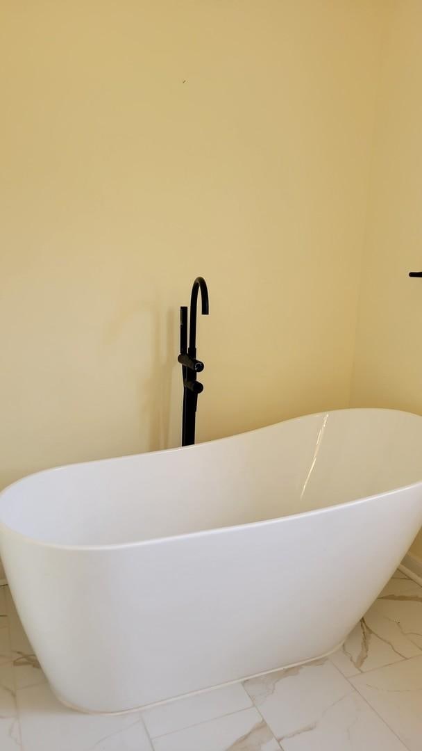 630 Maple Ct, Elburn, IL 60119 - full bath featuring marble look tile flooring and a freestanding tub
