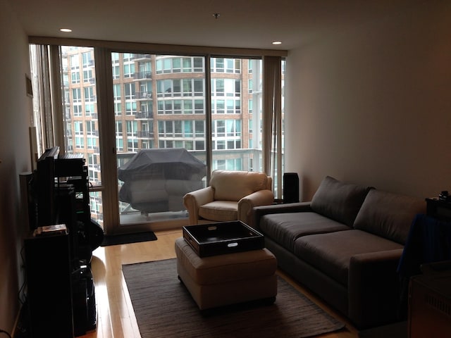 653 N Kingsbury St Unit 1208, Chicago, IL 60654 - living area with plenty of natural light, wood finished floors, and floor to ceiling windows