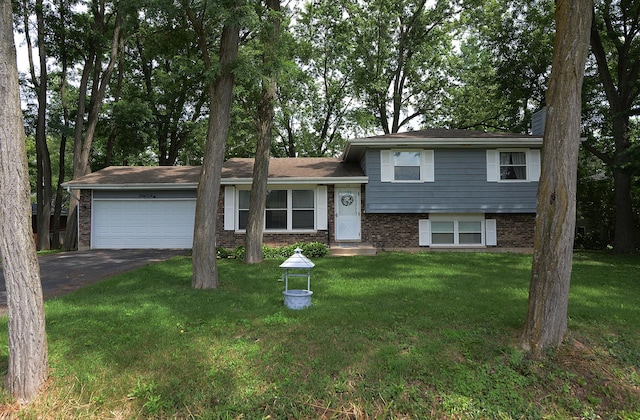 29W324 Grove Ave, West Chicago, IL 60185 - split level home with asphalt driveway, a garage, brick siding, and a front lawn