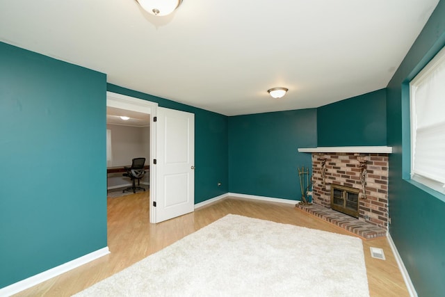 29W324 Grove Ave, West Chicago, IL 60185 - unfurnished living room with wood finished floors, a fireplace, and an office area