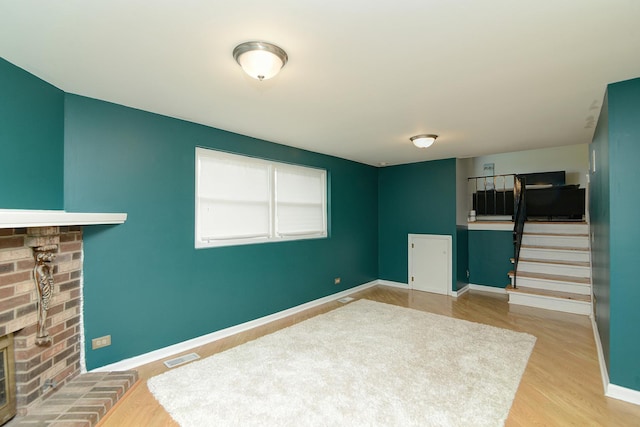29W324 Grove Ave, West Chicago, IL 60185 - living room with a fireplace, wood finished floors, and stairs