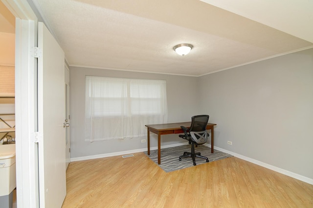 29W324 Grove Ave, West Chicago, IL 60185 - home office with light wood-style flooring and ornamental molding