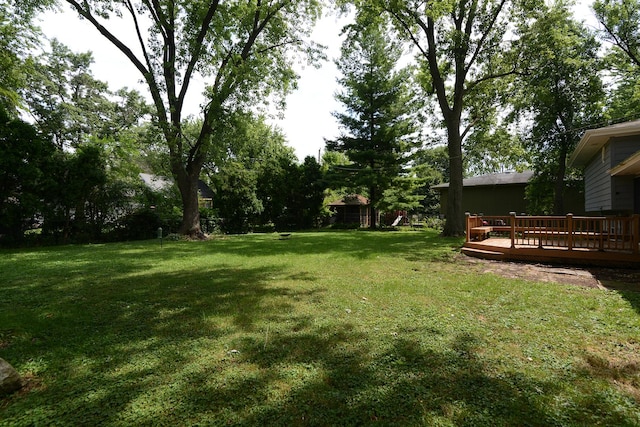 29W324 Grove Ave, West Chicago, IL 60185 - view of grassy yard with a wooden deck