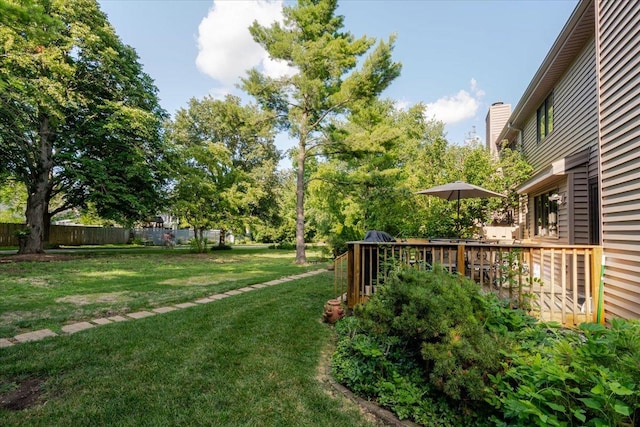 141 Manor Cir, Bloomington, IL 61704 - view of yard with a deck and view of scattered trees