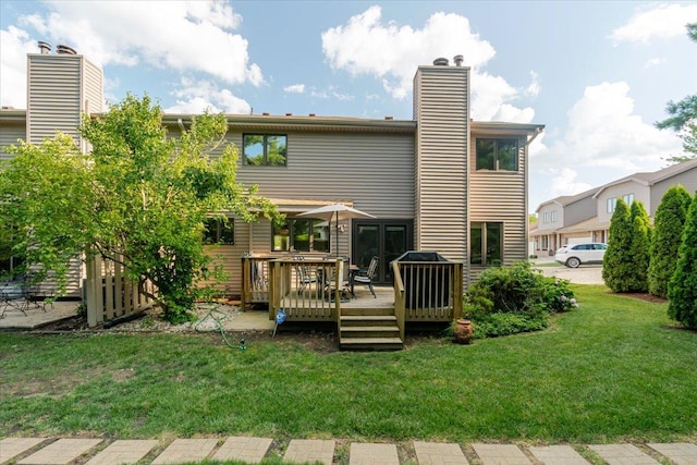 141 Manor Cir, Bloomington, IL 61704 - back of house featuring a deck, a chimney, and a lawn
