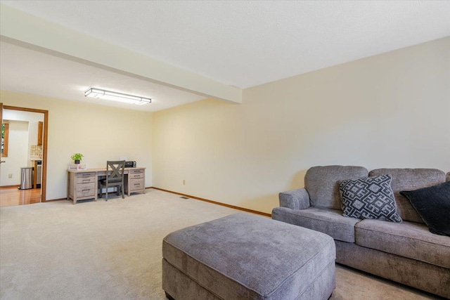 141 Manor Cir, Bloomington, IL 61704 - living area with light carpet and beamed ceiling