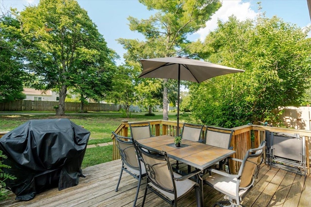 141 Manor Cir, Bloomington, IL 61704 - wooden terrace with outdoor dining area, a fenced backyard, and a grill