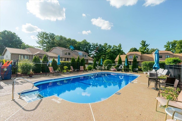 141 Manor Cir, Bloomington, IL 61704 - community pool featuring a patio and a residential view