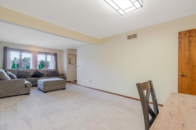 141 Manor Cir, Bloomington, IL 61704 - carpeted living room with baseboards